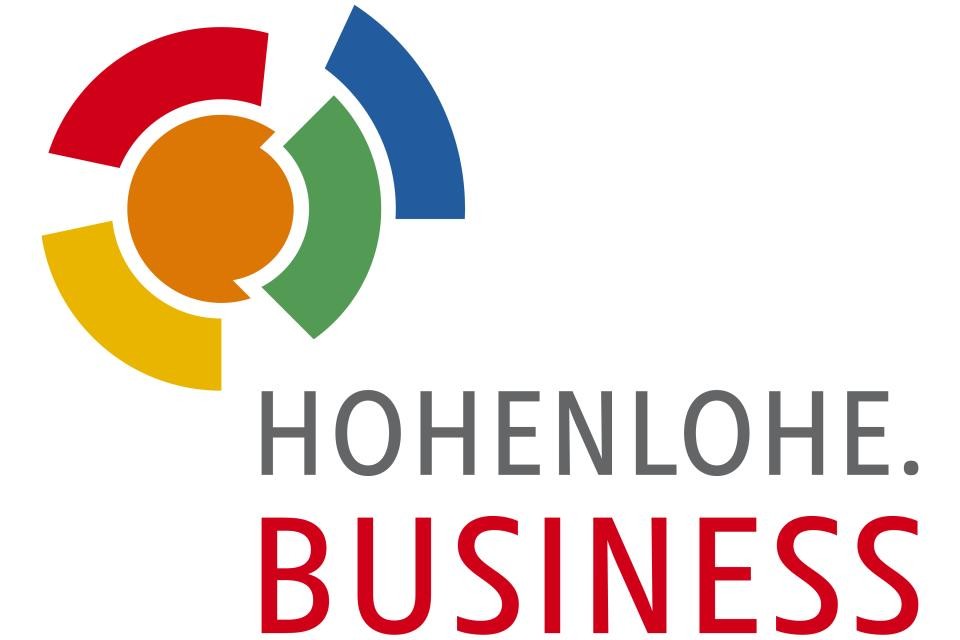 Logo von Hohenlohe Business. Text in grau: Hohenlohe. Text in rot: Business. Links oben Kreis in bunt