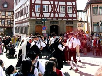 festival with dancing people. They weare tradicional clothes