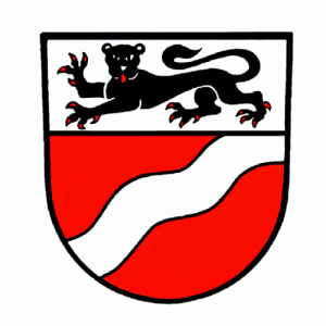 Auf dem Weißbacher Wappen ist oberhalb ein hersehender schwarzer Leopard auf weißem Hintergrund abgebildet. Unterhalb ist das Wappen rot und es ist ein weißer Schleier diagonal gewellt durchgezogen.